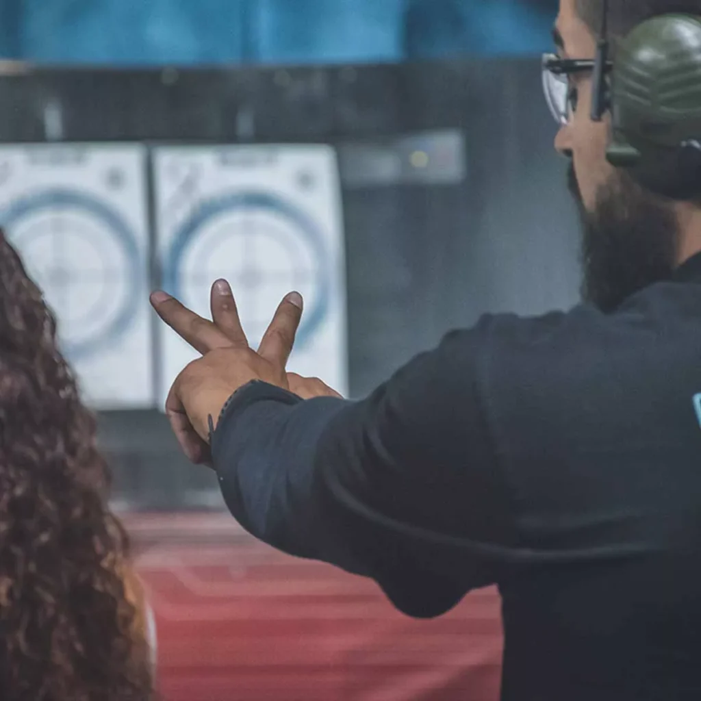 instructor showing the aim method budapest shooting range